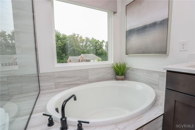 VIRTUAL STAGING. Photo represents the plan with virtual staging. Luxurious primary suite. | Image 23