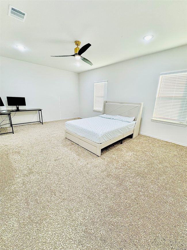 Carpeted bedroom with recessed lighting and a ceiling fan | Image 25