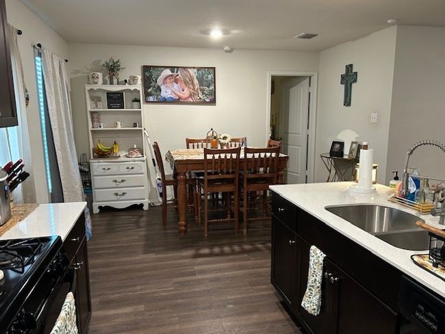 Large dining space with recess lighting and vinyl flooring. | Image 9