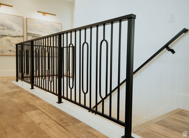 Stairway with hardwood / wood-style floors | Image 6
