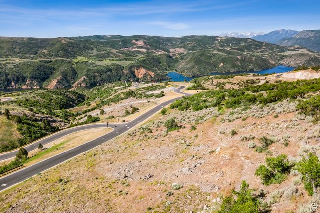 Mountain view featuring a nearby body of water | Image 13