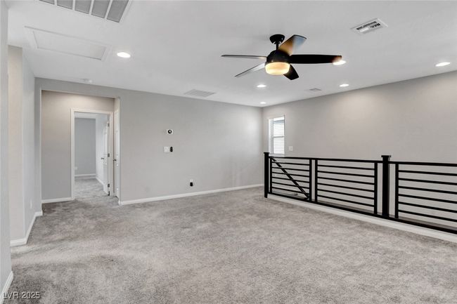 Unfurnished room featuring ceiling fan, baseboards, carpet, attic access, and recessed lighting | Image 27