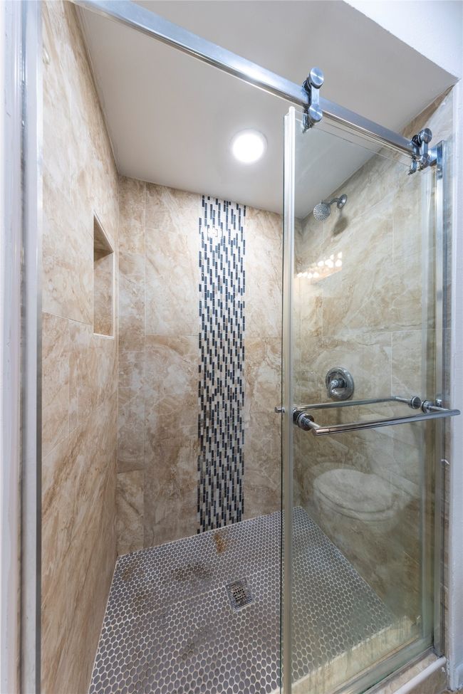 Barn door styled glass shower enclosure. | Image 18