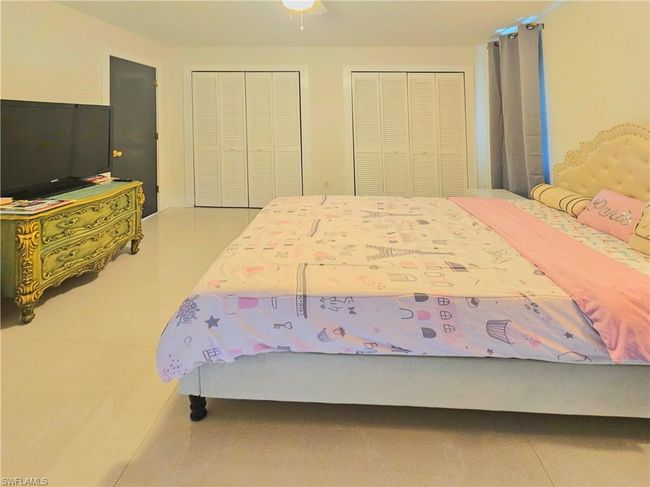 Bedroom with tile patterned flooring. | Image 22