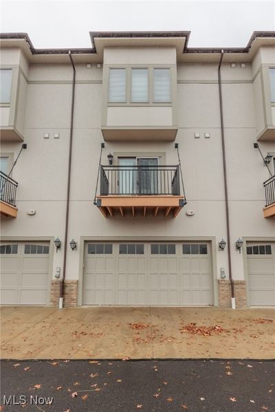 View of building exterior featuring a garage | Image 3