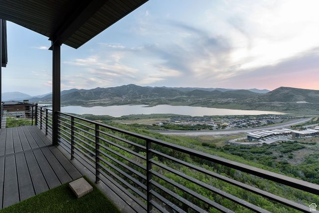 Balcony featuring a water and mountain view | Image 88