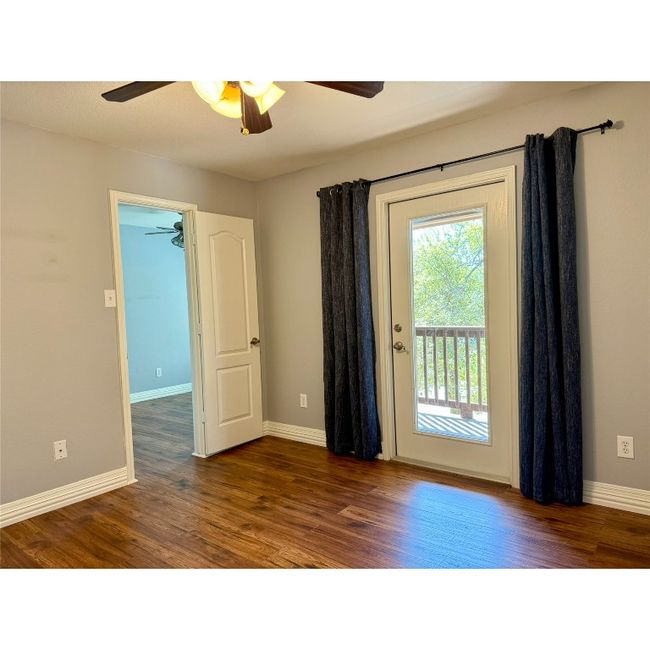 This shows the door leading to the bonus room which is between this bedroom and the primary bedroom. One could use this bonus room area to create closet space for this bedroom | Image 32