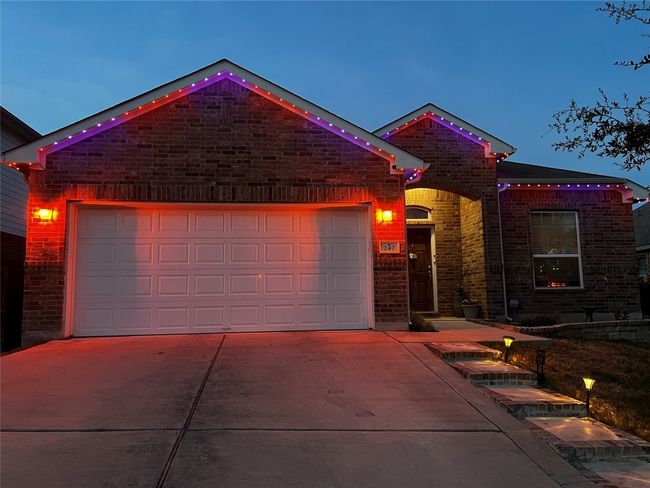 View of front of house with concrete driveway, an attached garage, and brick​​‌​​​​‌​​‌‌​‌‌​​​‌‌​​‌‌​‌​​​​​‌ siding | Image 19