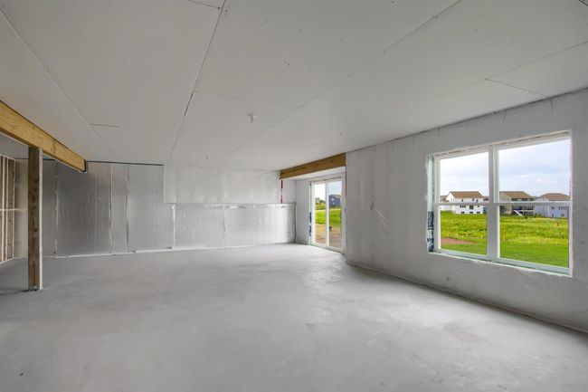 Unfinished lower level with walkout to backyard. Model photo. | Image 33