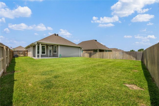 Back of house with a patio area and a shingled roof | Image 6