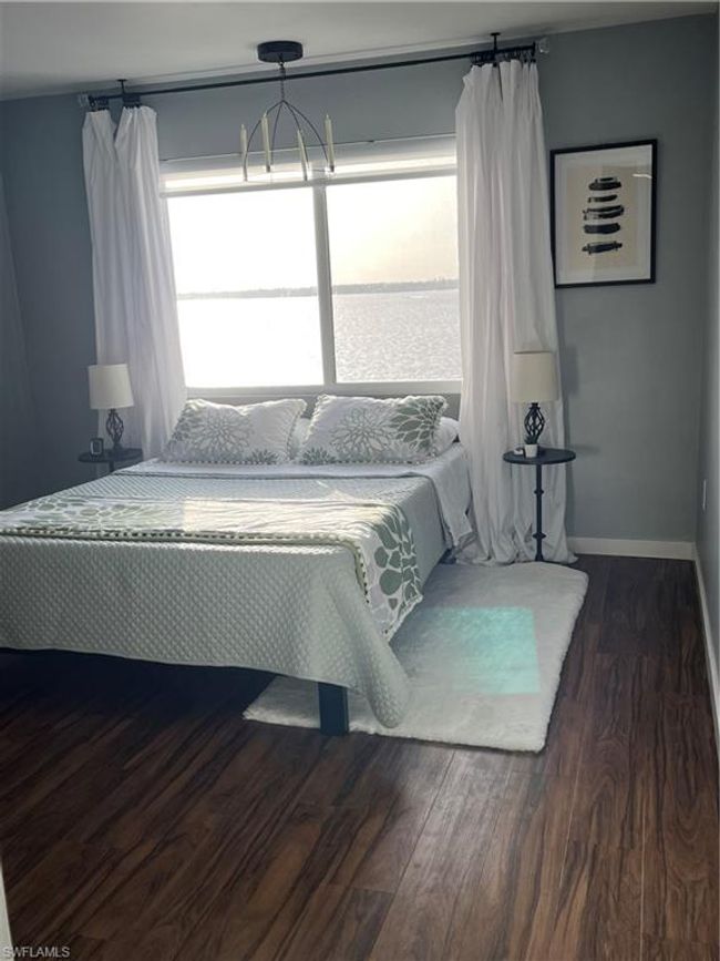 Bedroom featuring dark wood finished floors | Image 10