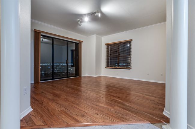 This open-concept layout seamlessly blends the dining room, kitchen, and living area into one expansive space—perfect for hosting dinner parties, enjoying a beverage at the island, or lingering with friends long after the last toast. | Image 15