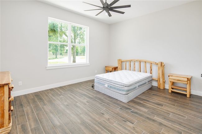Mudroom featuring wood tiled floors and baseboards | Image 19