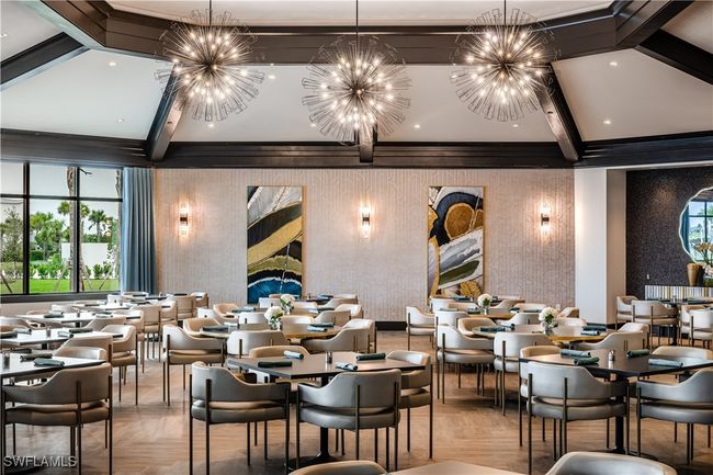 Dining space with beam ceiling, wallpapered walls, and a chandelier | Image 50