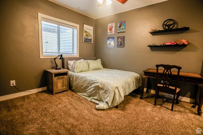 Carpeted bedroom featuring baseboards and ceiling fan | Image 30