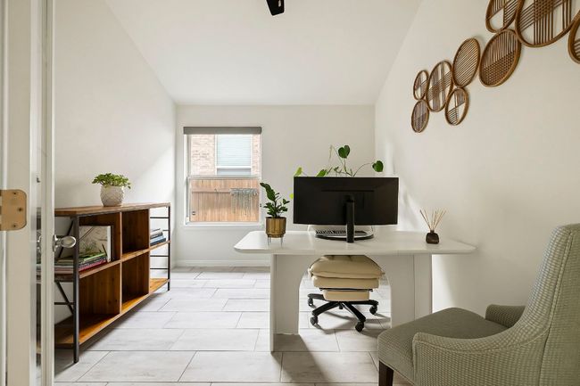 A dedicated home office offers the perfect remote work setup or quiet retreat. | Image 17