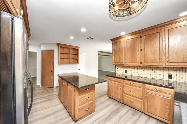 Built in cutting board, wine rack, cookie sheet cabinet, tons of space! | Image 13