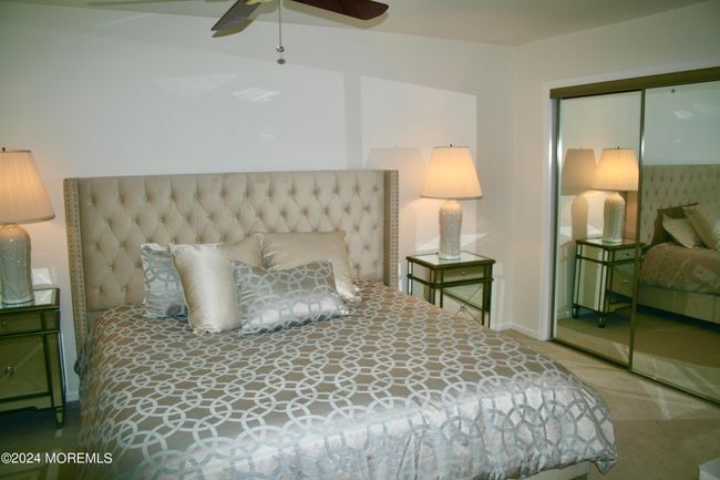 Master bedroom with mirrored closet | Image 16