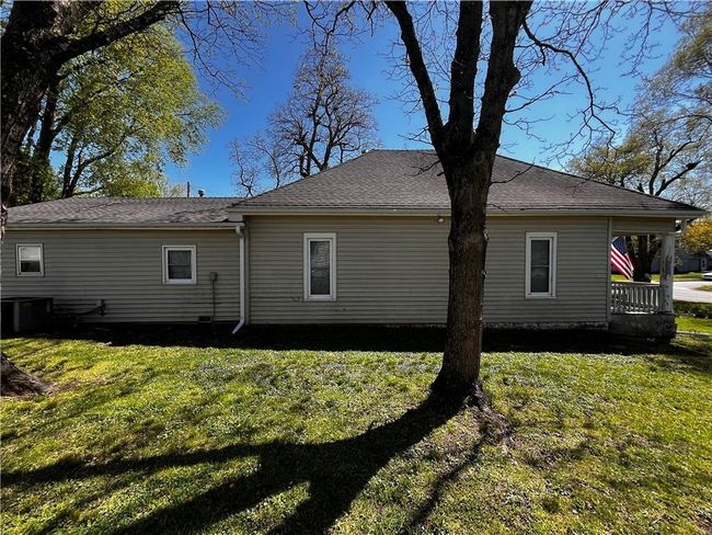 Rear view of property featuring a yard | Image 5