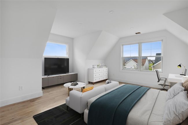 Bedroom featuring lofted ceiling, light wood-style floors, and baseboards | Image 19
