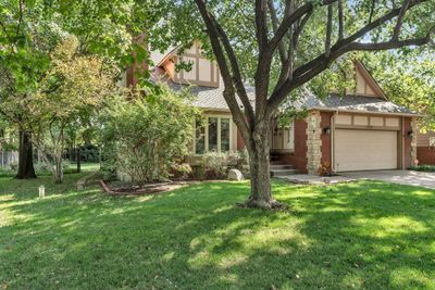 View of front of property featuring a front yard and a garage | Image 2