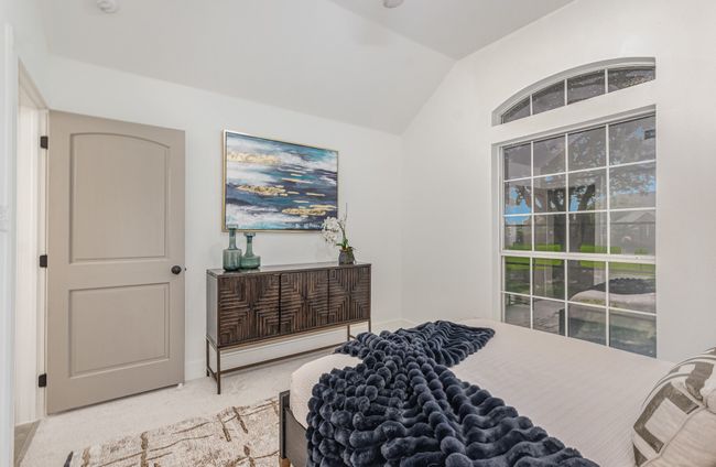 Bedroom featuring vaulted ceiling and carpet floors | Image 30