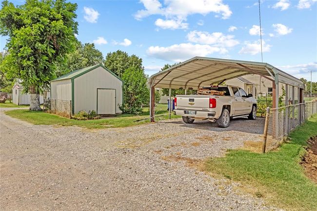 View of parking with a carport | Image 4