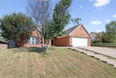 Single story home featuring a garage and a front lawn | Image 2