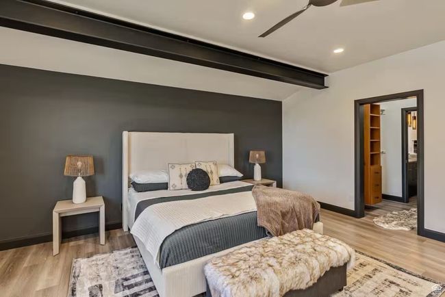 Bedroom featuring baseboards, a ceiling fan, beamed ceiling, light wood-type flooring, and recessed lighting | Image 52
