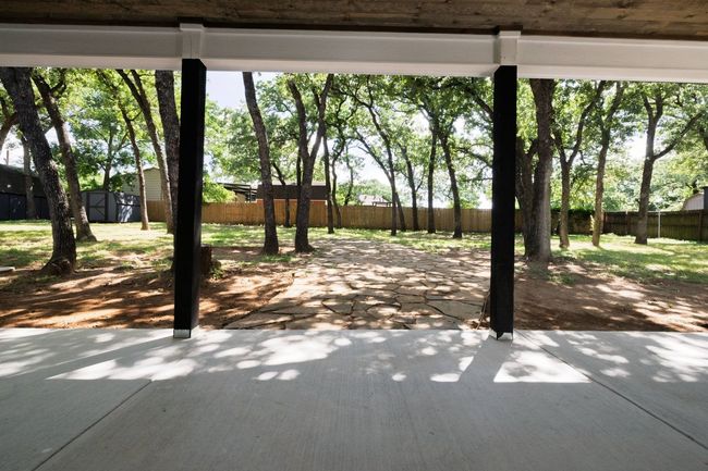 Fenced backyard featuring a patio and a shed | Image 39