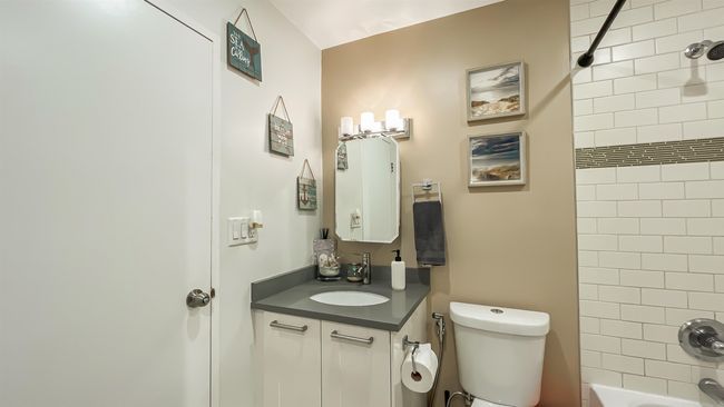 Bathroom featuring toilet, shower / tub combination, and vanity | Image 18