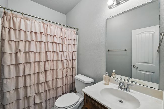 Full bathroom with vanity and curtained shower | Image 36