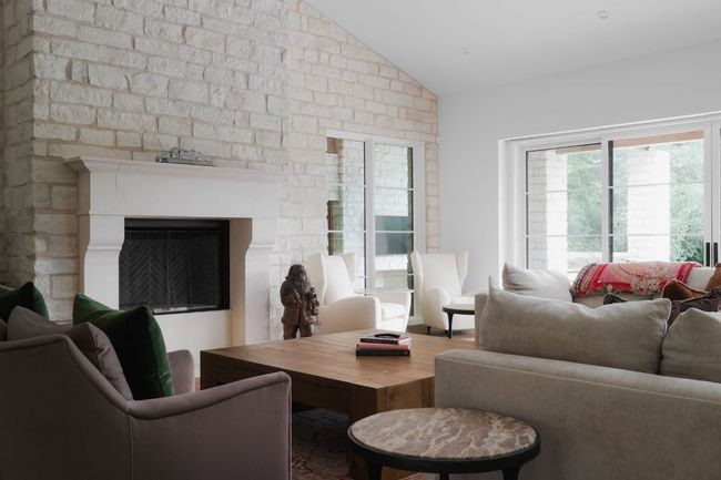 Living room featuring vaulted ceiling and a fireplace | Image 12
