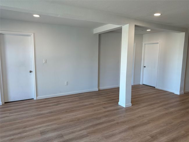 Basement featuring baseboards, wood finished floors, and recessed lighting | Image 14