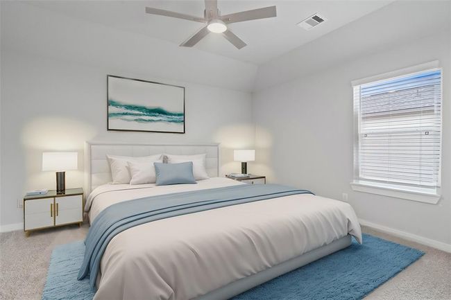 Secondary bedroom features plush carpet, custom paint, ceiling fan with lighting and a large window with privacy blinds. | Image 17