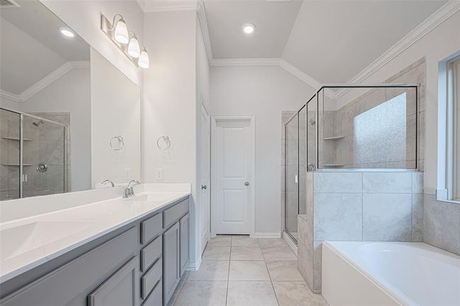 Primary ensuite with double vanity and glass enclosed shower | Image 27
