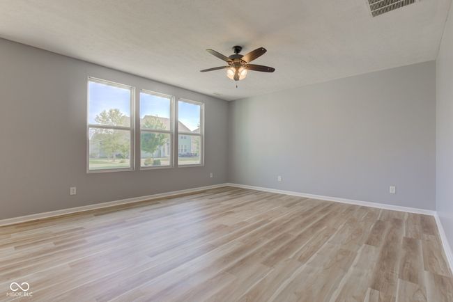 unfurnished room with ceiling fan and light wood-style floors | Image 21
