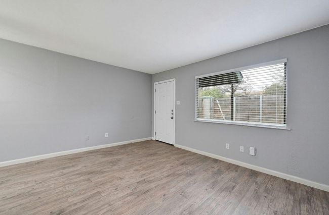 Unfurnished room with light wood-style floors and baseboards | Image 9