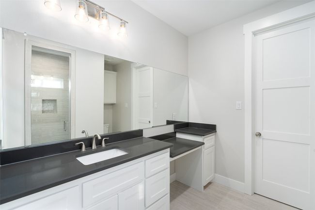 Bathroom with hardwood / wood-style flooring, vanity, an enclosed shower, and toilet | Image 21