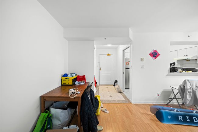 Dining area featuring light wood finished floors and baseboards | Image 15