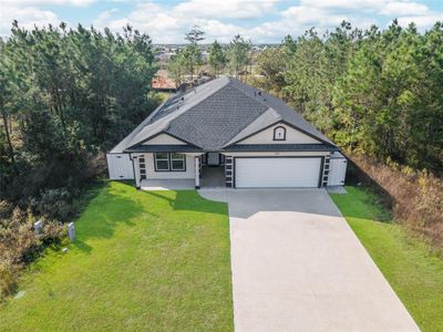 Spacious driveway surrounded by mature trees | Image 2