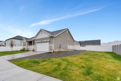 View of side of property with a yard and a garage | Image 3