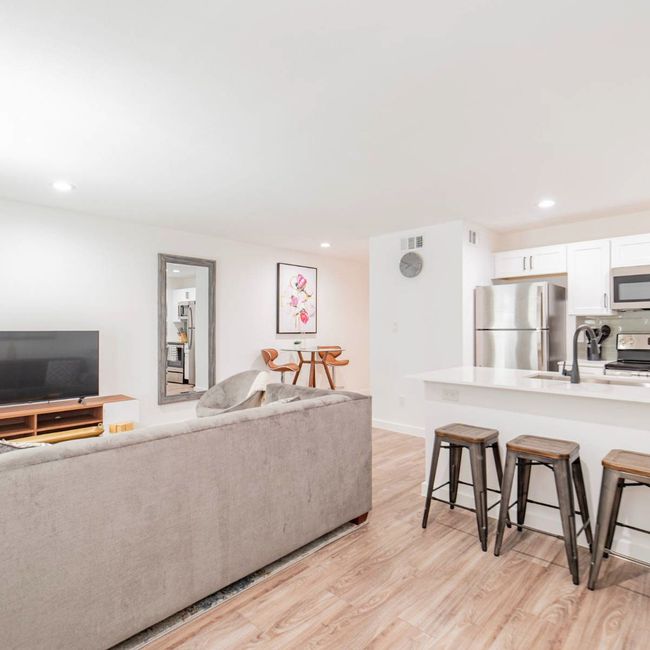 Living room with light wood-type flooring, baseboards, and recessed lighting | Image 5