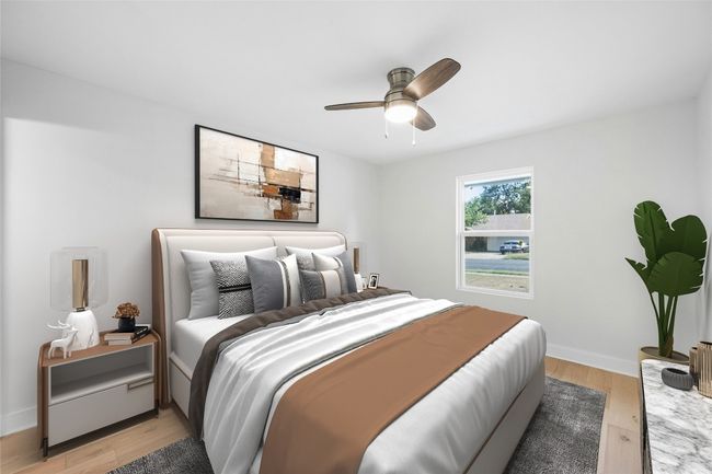 Bedroom featuring light wood-type flooring and ceiling fan | Image 29