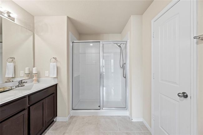 Dual vanities in your en-suite primary bath, offer personal space with tons of dedicated cabinet space. | Image 14
