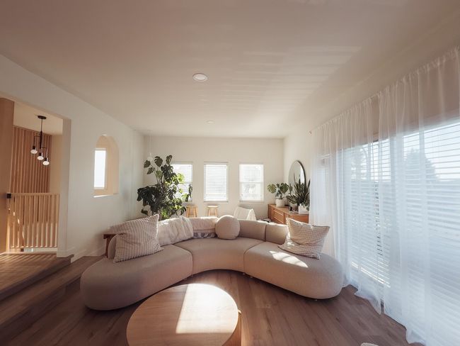 Living room featuring wood finished floors and a chandelier | Image 15