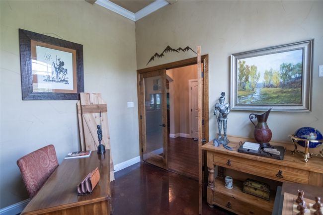 Office space featuring finished concrete floors, ornamental molding, and baseboards | Image 9