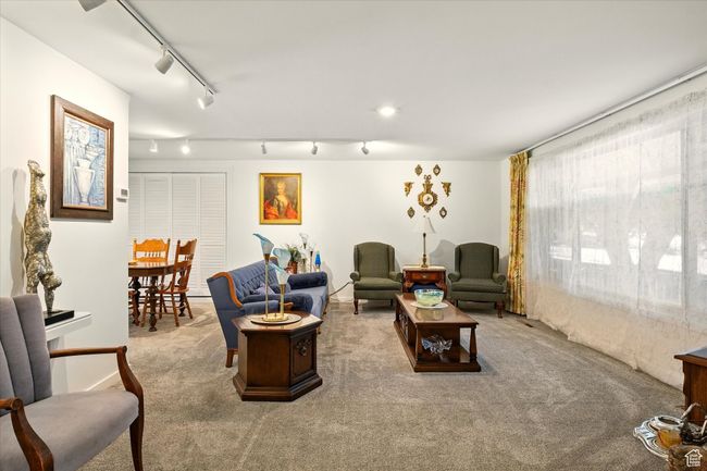 Living area with track lighting and carpet floors | Image 8