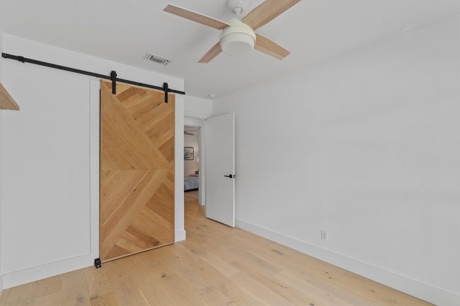 The sliding door add a decorative touch to conceal your belongings. | Image 19
