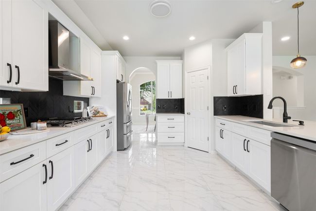 Modern upgraded kitchen, counter with lighting bottom and top. | Image 11